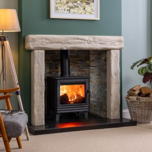 Grantham cast beam surround shown with slate chamber and black granite hearth with woodburner